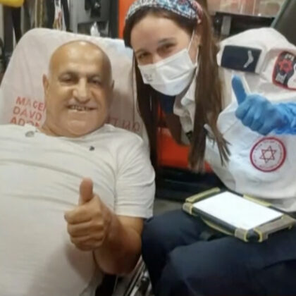 EMT uses sign language to communicate with deaf patient.