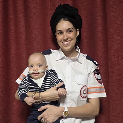 Supermom paramedic delivers her own baby, then saves his life with CPR.