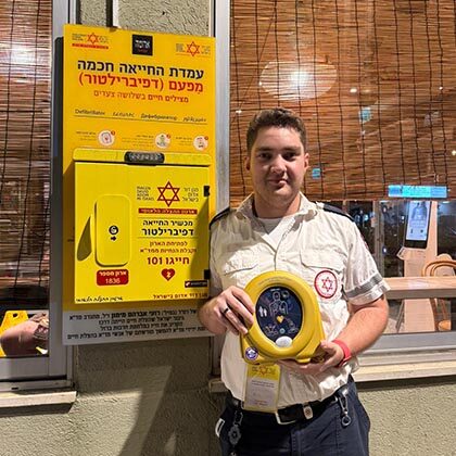 EMT saves man with defibrillator he was inspecting moments earlier.